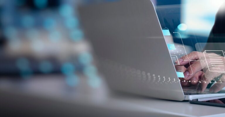 person using touch screen laptop